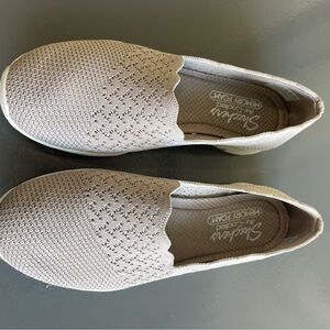 Skechers Cream Flats Slip-On Shoes with Textured Design